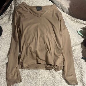 tan shirt , kinda tight